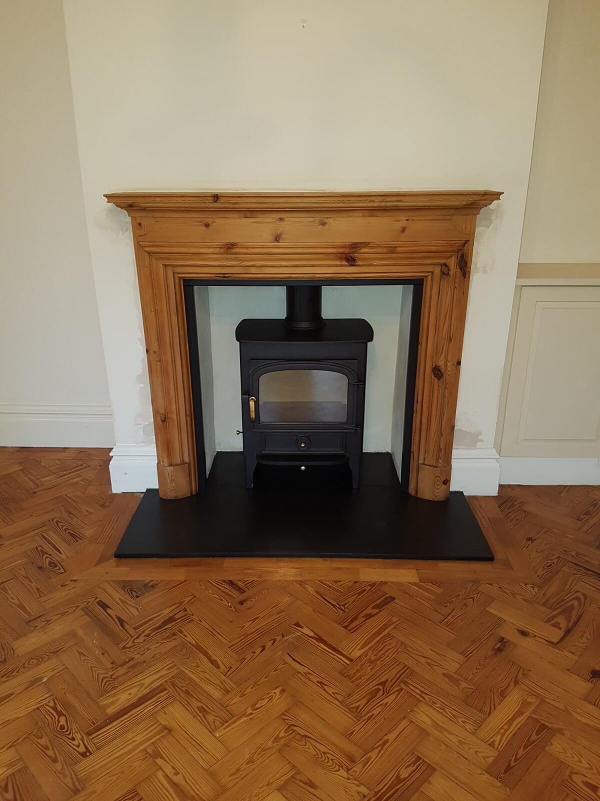 Wooden surround fitted with black edging slips